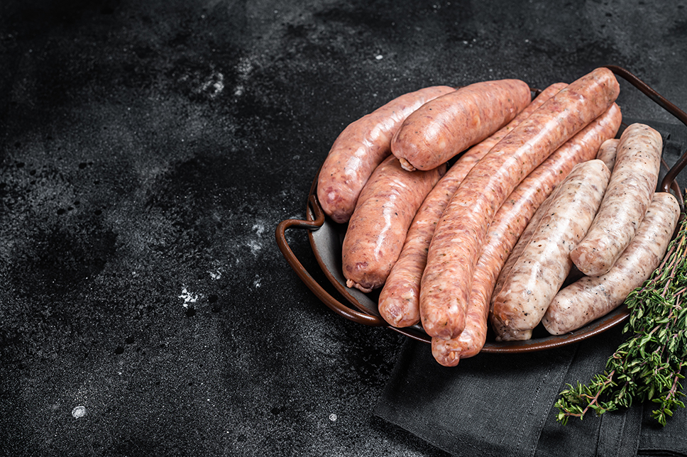 sausages variation in steel tray raw sausages
